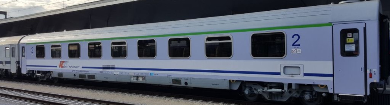 A refurbished Polish InterCity coach being used on an EIC service between Wien and Warszawa