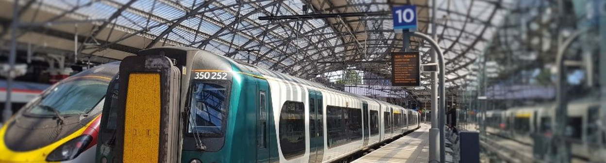 A Desiro train to the right of a Pendolino train 