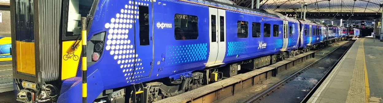 A train awaits departure from Glasgow - note the cycle symbol