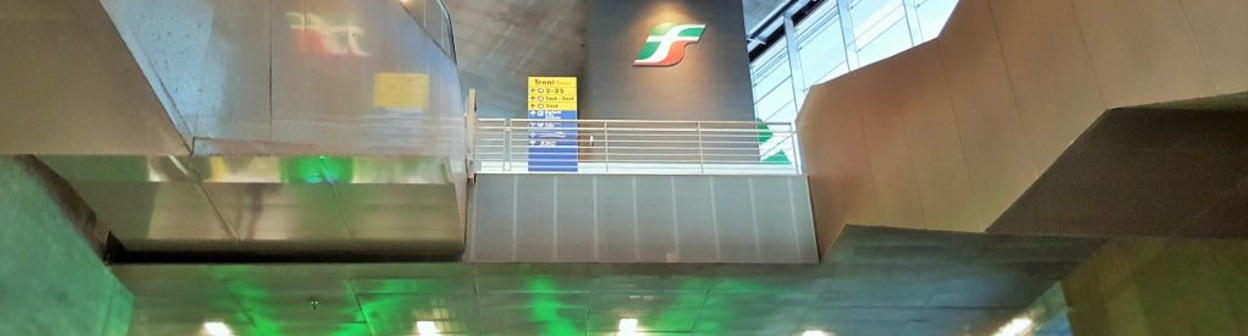 The atrium which houses the escalators that link street level to the bridge which spans the station