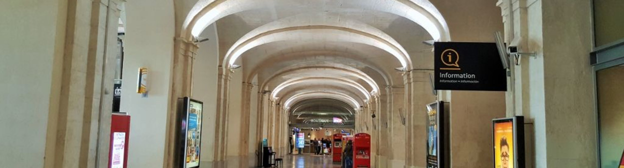 Looking across the spectacular main hall at Nimes station towards the ticket offices