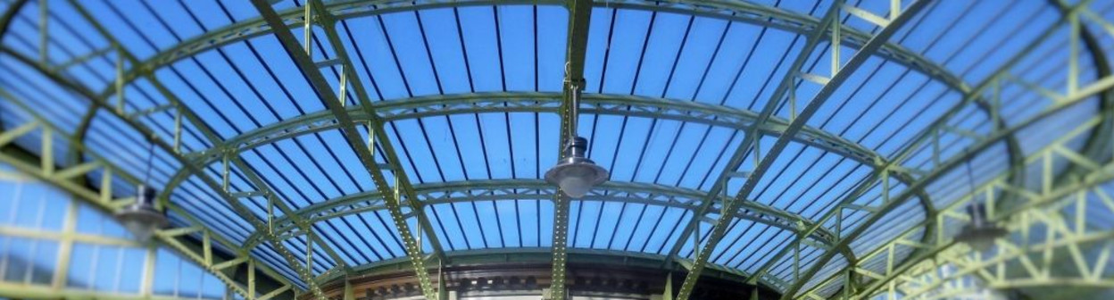 The prettiest station ticket office in Britain supports the elegant roof