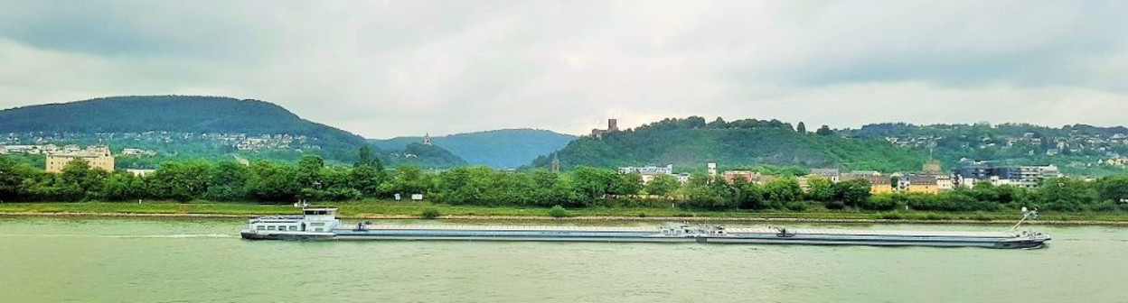 Following the boats down the Rhine on a grey day