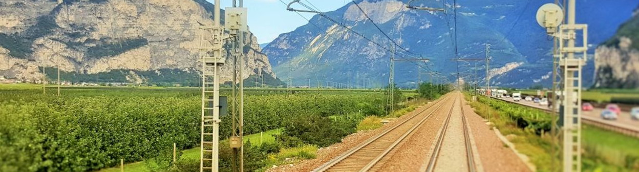 The view from the rear window as the train heads through the valley north of Trento