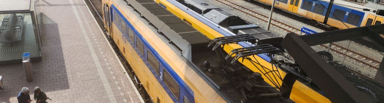 Cyclists wait to board a train at Rotterdam Centraal