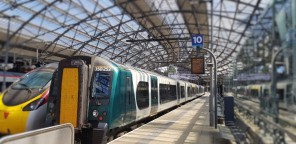 A Desiro train to the right of a Pendolino train 