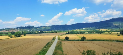 North of Rome on the right, there are distant views of the Apennine foothills