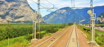 The view from the rear window as the train heads through the valley north of Trento