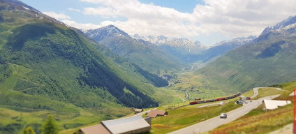 Ride the Glacier Express through the Oberalp Pass east of Andermatt