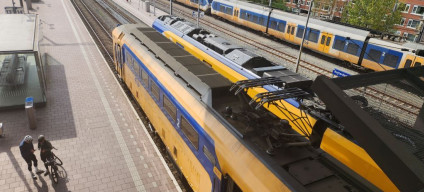 Cyclists wait to board a train at Rotterdam Centraal