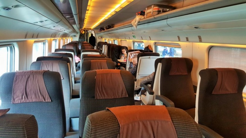 A 1st class seating saloon on a tilting Frecciabianca train