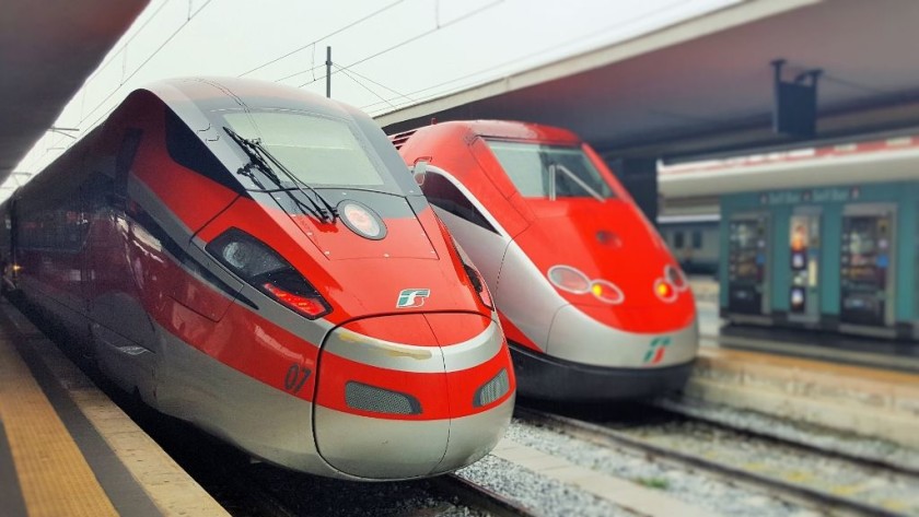 A Frecciarossa 1000 train on the left and a Frecciarossa 500 on the right