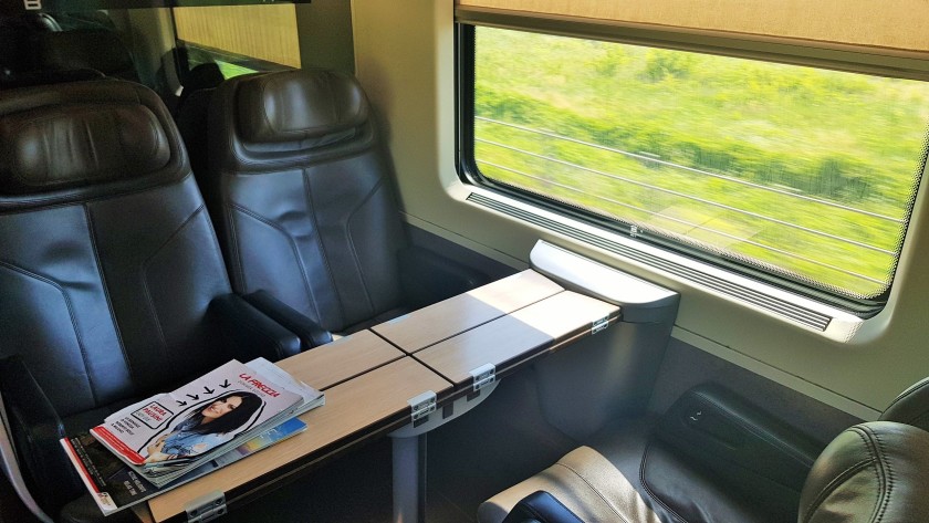 The tables on these trains can be opened up, in this image they are closed