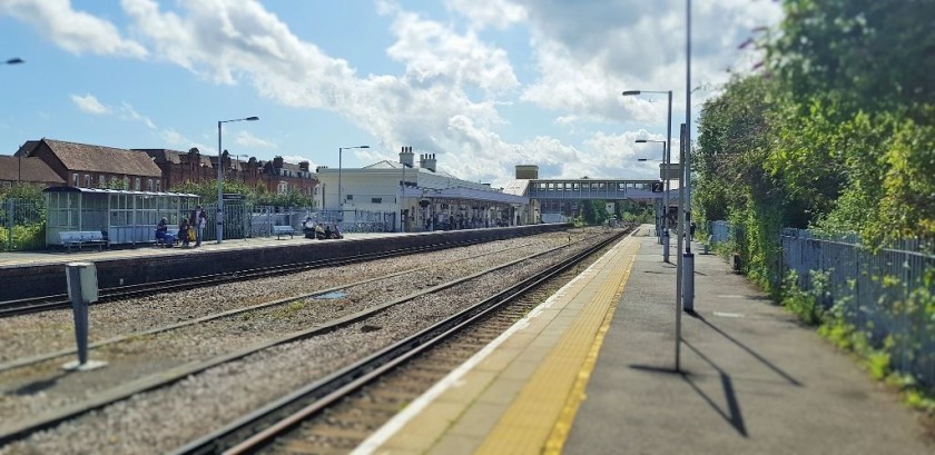 Looking along platform 2, the access to the subway is opposite the white building over on platform 1