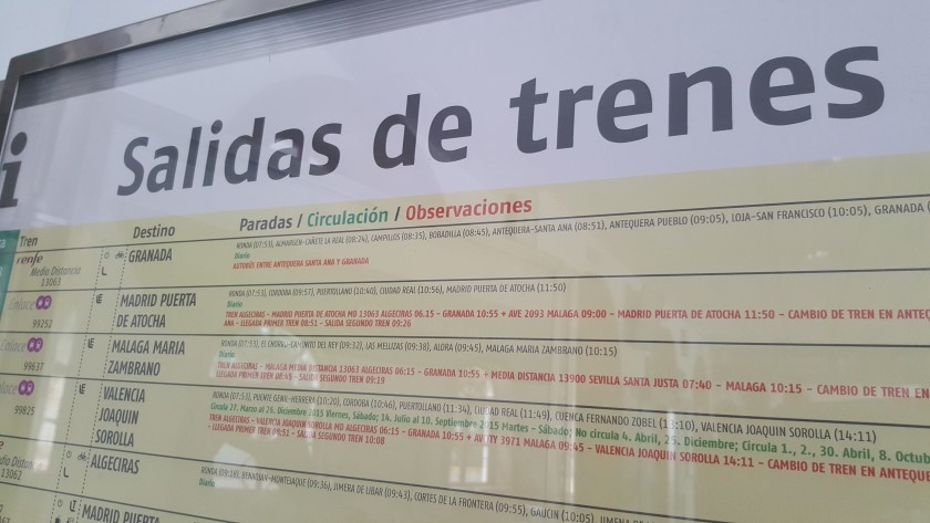 The train departure info is listed on these 'Salidas de trenes' posters