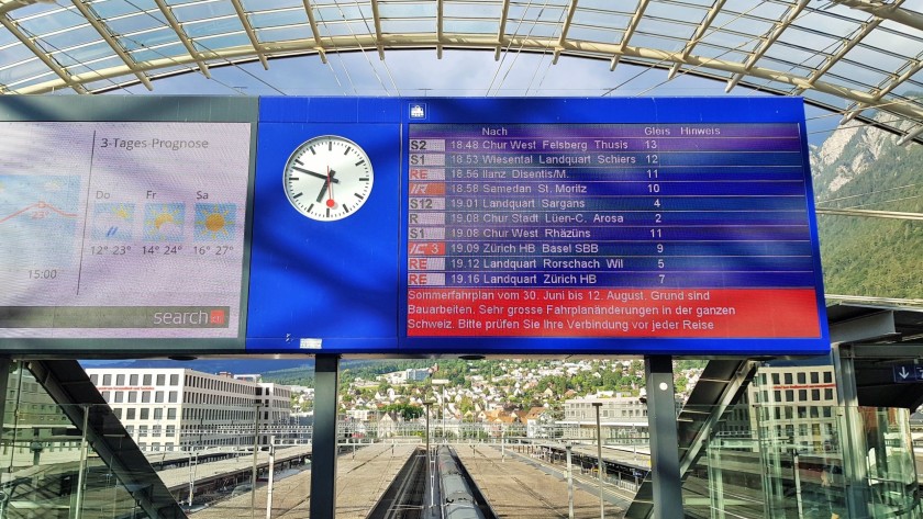 Train departure details are shown in the bus station