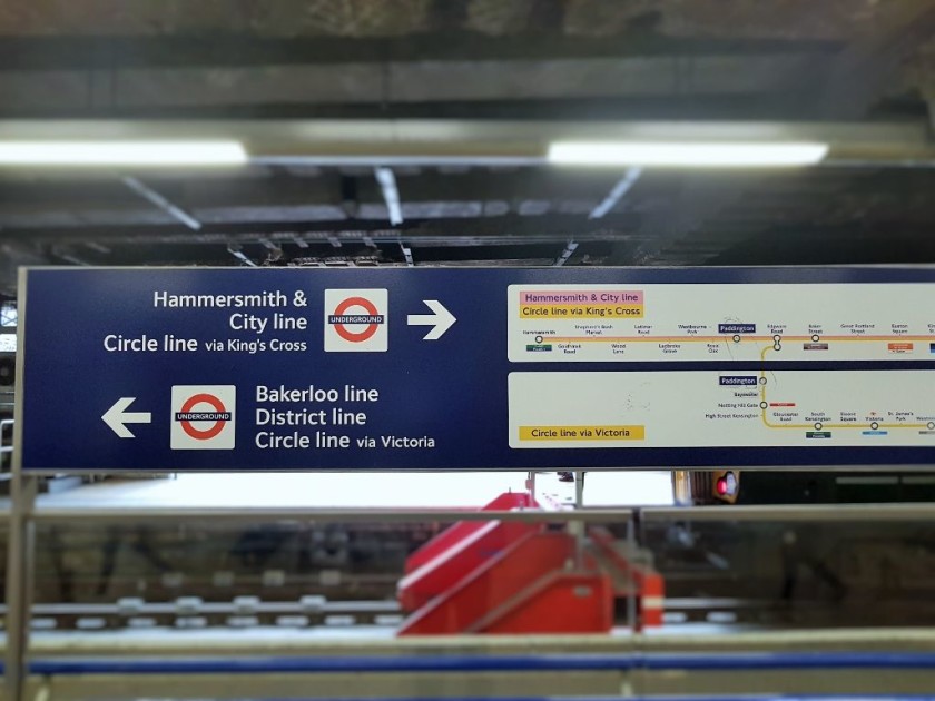 A sign by the entrance platform 10 pointing the way to both of the Underground stations