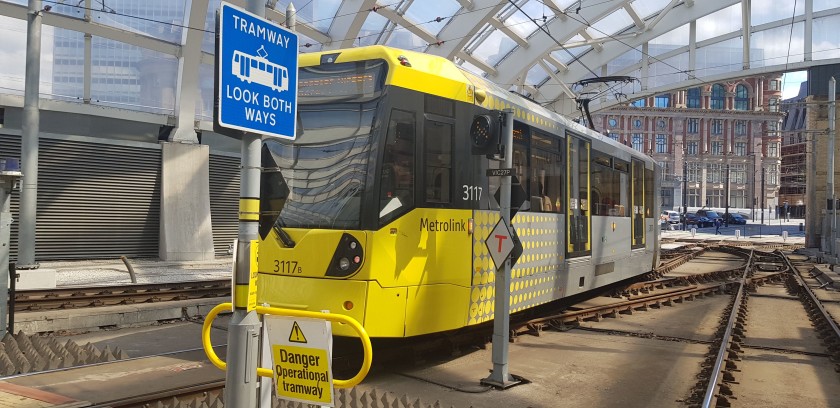 A tram heads into the city centre