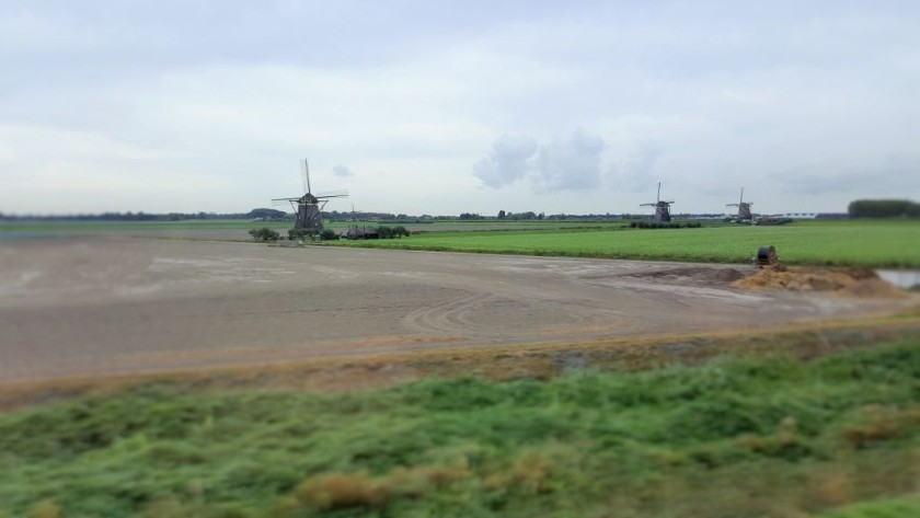 You can glimpse windmills from the high speed line between Schiphol and Rotterdam