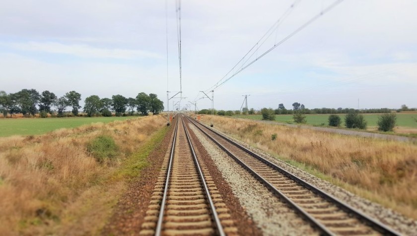 The flat landscape that the train travels through