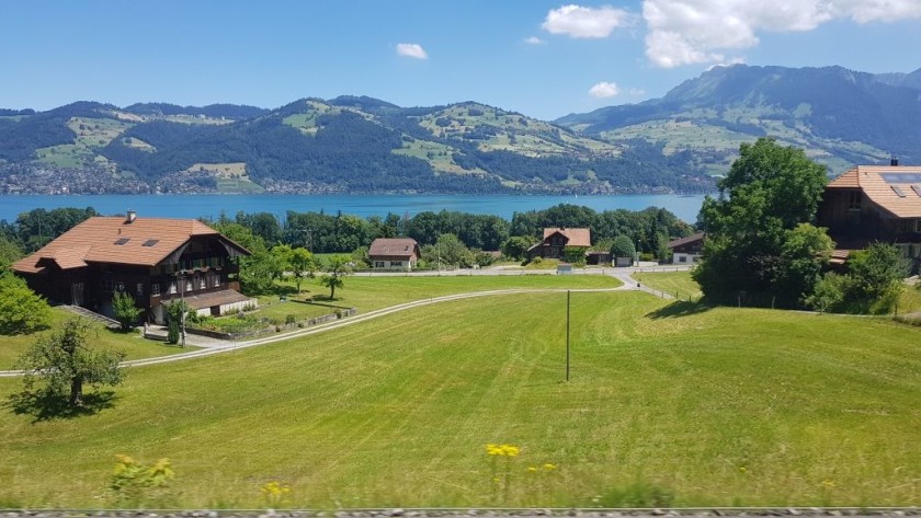 Lake Thun can be glimpsed from the train between Thun and Spiez