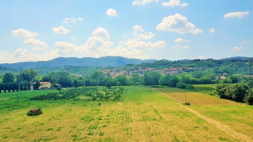Flashing through Tuscany as the train heads south to Rome