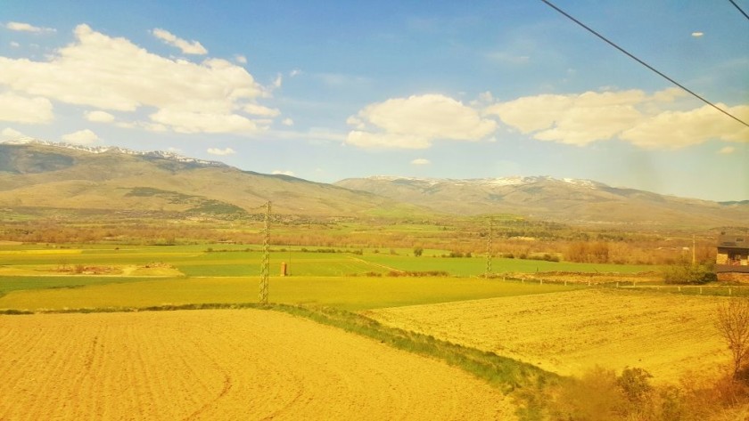 For the final 15 mins the trains cross a plain with distant views of the Pyrenees in all directions