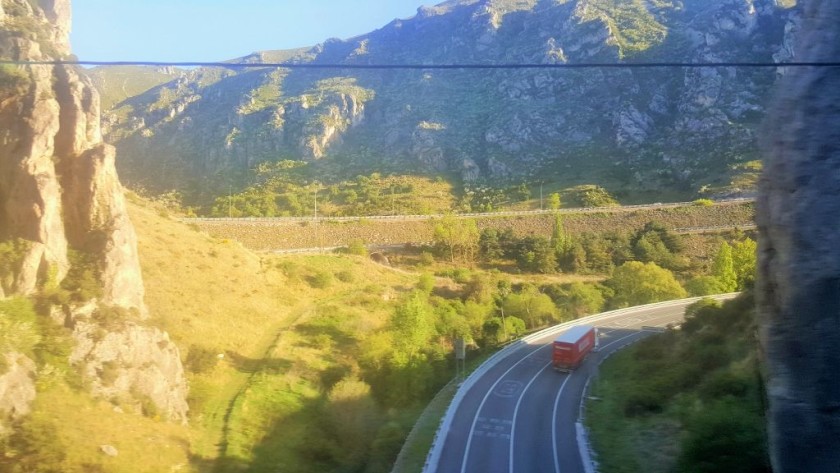 The train travels through mountain passes after it has travelled through Burgos