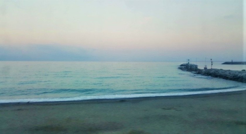 Travelling by the sea at sunset through the Italian Riviera