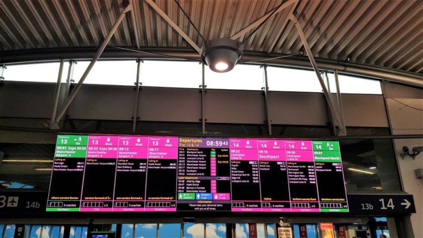 The colour coded departure screen in the platform 13-14 waiting area
