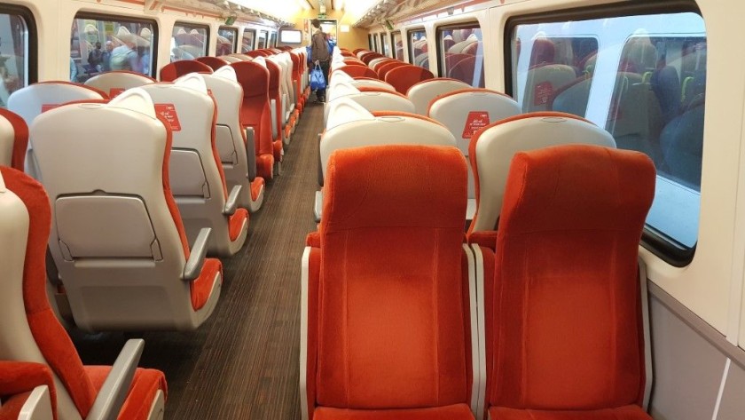 The standard class seating saloon offers a mix of seats at tables and airline style seats