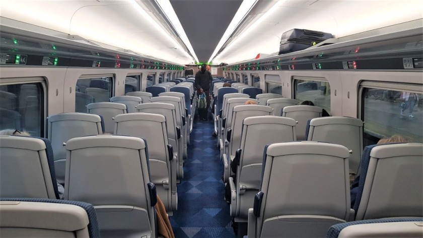 The standard class seating saloon has a mix of 'airline' and table seats