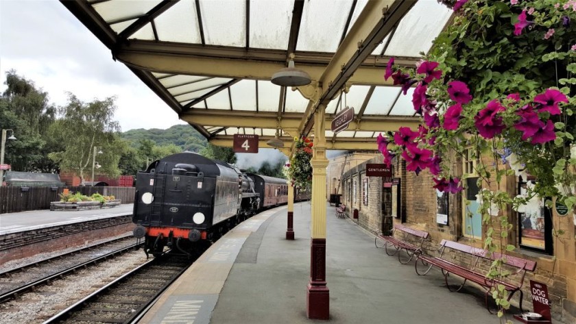 A train arrives in beautiful Keighley station