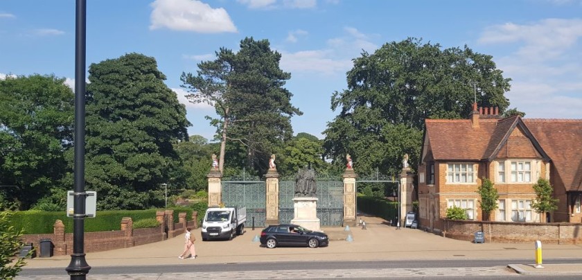 The park gates are across the street from the station