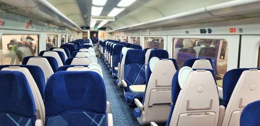 The interior of a Standard Class coach on an Inter7City train