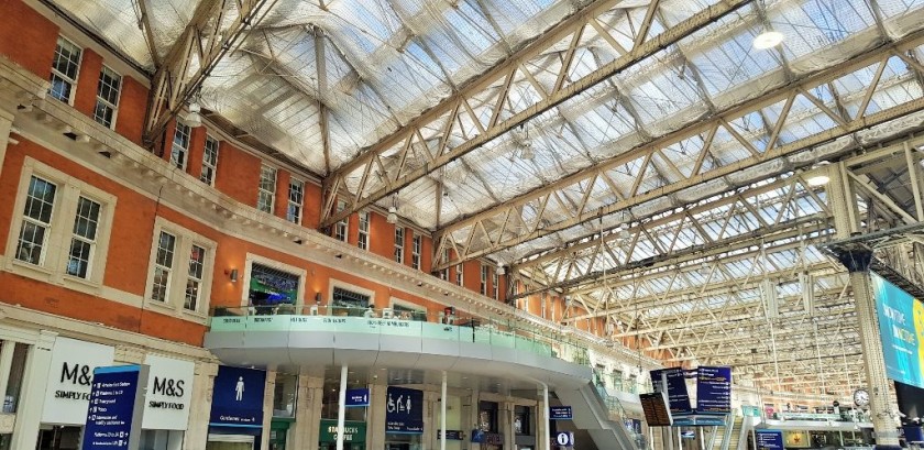 Multiple escalators and elevators connect the concourse to this balcony level