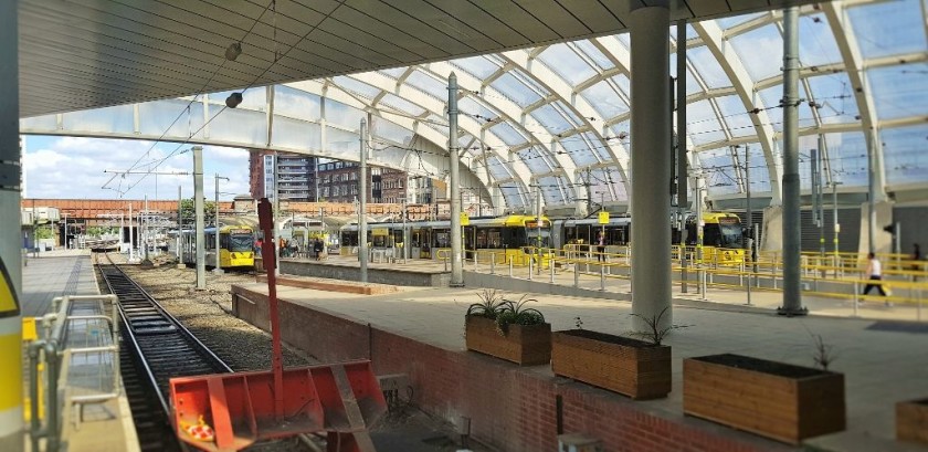 The tram stops are beside platforms 1 and 2