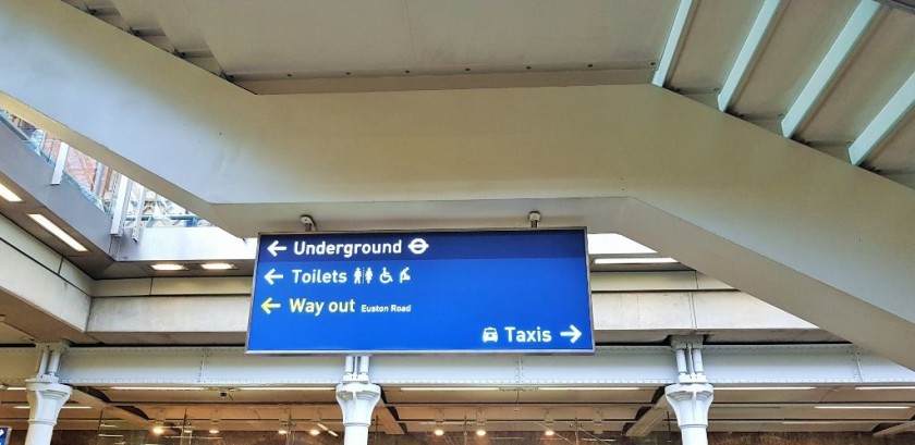 The sign by the Arrivals exit door pointing the way to the Underground