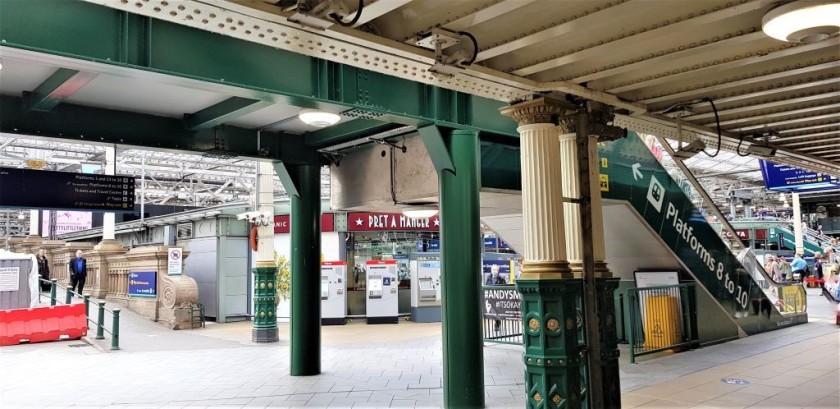 This escalator to the right leads up to the footbridge, go left on it to access the Princess St exit