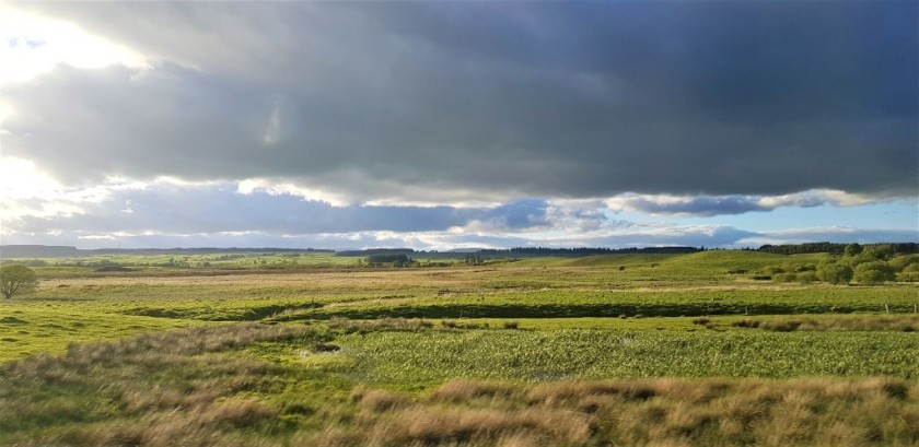 North of Larbert the views on the left stretch into the distance