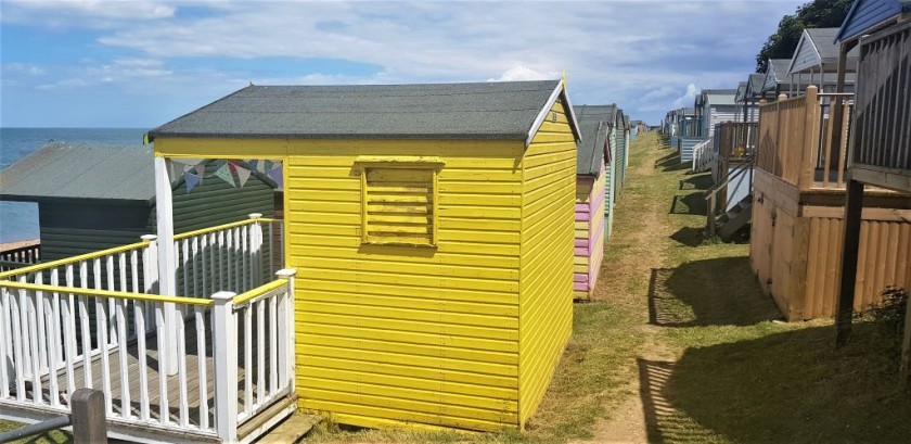 The terraces of beach huts east of the harbour