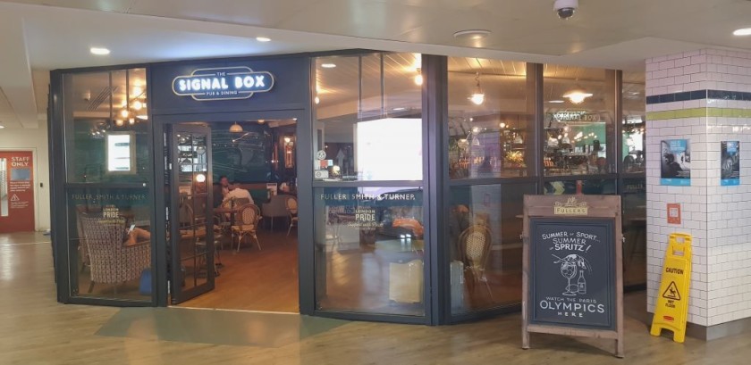 The entrance to the Signal Box pub is on the upper level food terrace