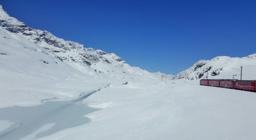 One of the newer RhB trains passes through the Bernina Pass