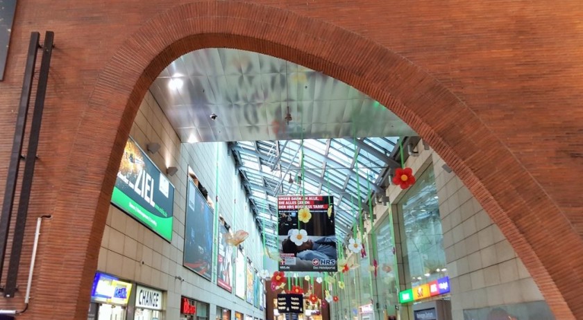 Looking into the hall from the secondary entrance, the travel desk is on the left