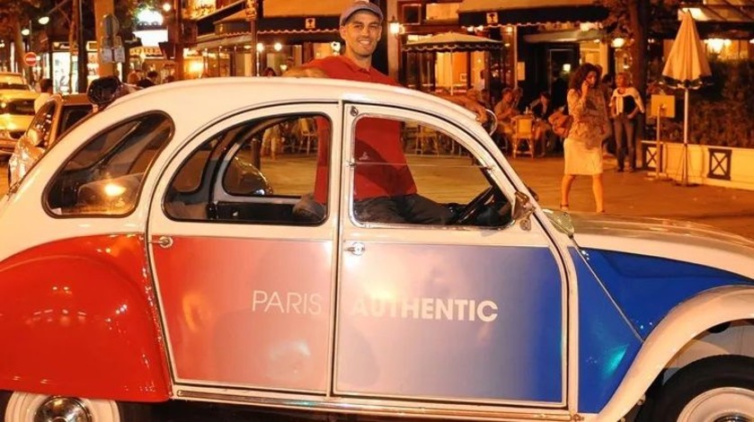 Montmartre by night in a 2CV with a bottle of champagne!