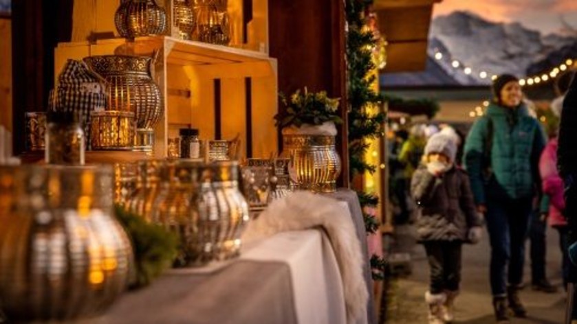 Visit a Christmas market with a backdrop of snowy peaks in Interlaken