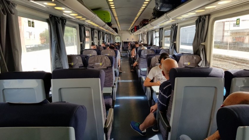A 2nd class seating saloon on a yet to be refurbished Trenitalia InterCity train