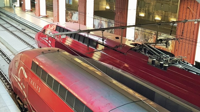 Thalys trains wait to depart - note the two different styles of power car