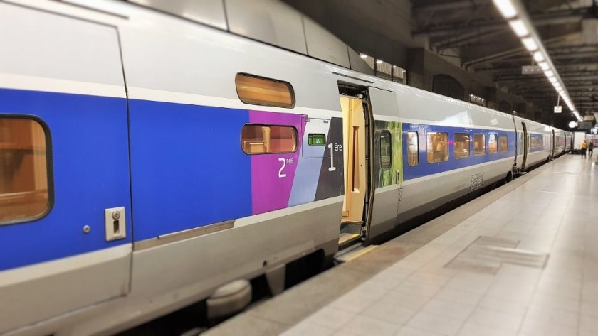 Close up of a TGB train - the green panel to the left of the door houses the coach number