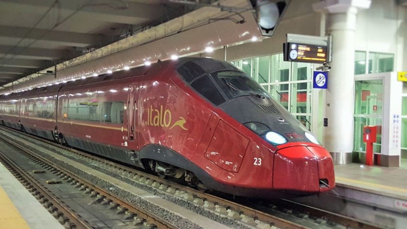 An Italo train arrives at the AV platforms in Bologna Centrale station.